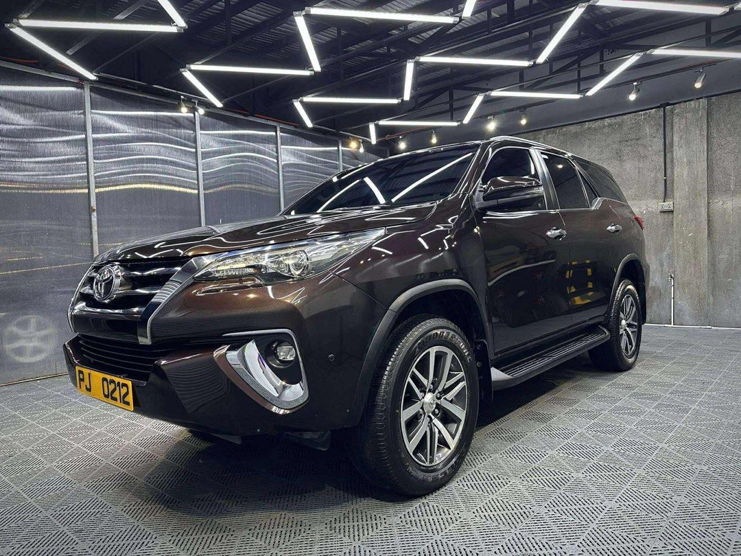Toyota Fortuner V Auto (Category: Used Cars) located in Manila. Submitted by quality_cars (Listing ID 1395219657, Image 3). Description: JUST IN‼️ TOYOTA FORTUNER V 2018 FOR SALE / SWAP / FINANCING 👍🏼 OWNER SELLER Year Model: 2018 Color: Phantom Brown (Ceramic Coated) Engine: 2.4-liter Turbo Diesel Transmission: 6-Speed Automatic Mileage: 50,000 Plate Ending: 3 Details: Keyless Entry Push to Start LED Headlights LED Foglights LED Taillights Pow