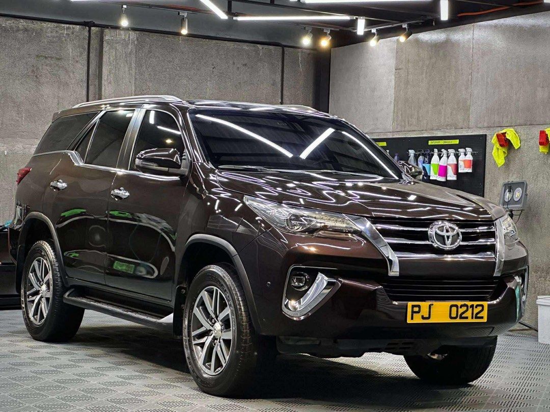 Toyota Fortuner V Auto (Category: Used Cars) located in Manila. Submitted by quality_cars (Listing ID 1395219657, Image 2). Description: JUST IN‼️ TOYOTA FORTUNER V 2018 FOR SALE / SWAP / FINANCING 👍🏼 OWNER SELLER Year Model: 2018 Color: Phantom Brown (Ceramic Coated) Engine: 2.4-liter Turbo Diesel Transmission: 6-Speed Automatic Mileage: 50,000 Plate Ending: 3 Details: Keyless Entry Push to Start LED Headlights LED Foglights LED Taillights Pow
