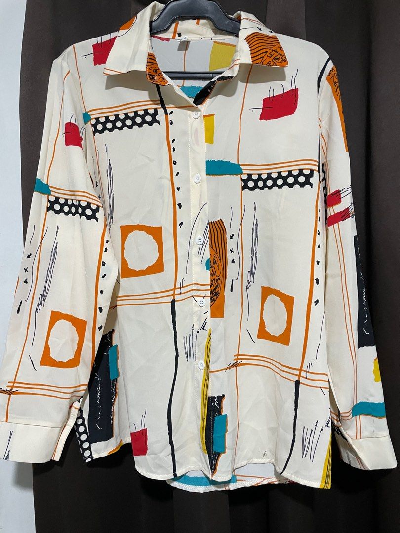 Abstract Print Long Sleeve Blouse (Category: Blouses) located in Pasig City. Submitted by archer07 (Listing ID 1395436204, Image 1). Description: - Long-sleeved blouse - Features an eye-catching abstract print - Collared neckline - Button-down closure - Unique design with various shapes and colors.