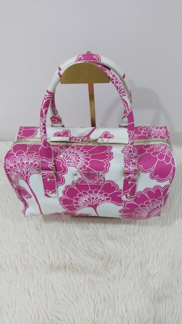 Authentic Kate Spade Cosmetic Handbag (Category: Luxury Bags & Wallets) located in Cainta. Submitted by pouchbucketbags (Listing ID 1395483991, Image 2). Description: - Authentic Kate Spade cosmetic handbag. - Features a beautiful pink and white floral design. - Designed as a vanity bag. - In good condition. - A stylish and functional accessory. - 8"H × 5"W × 12"L - Purchased in Japan.