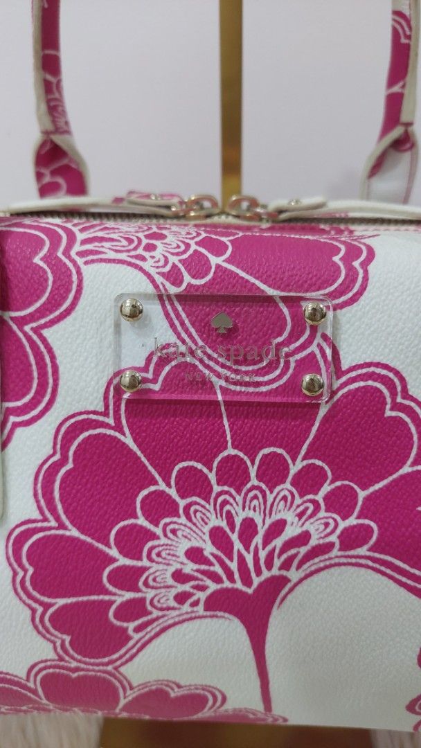 Authentic Kate Spade Cosmetic Handbag (Category: Luxury Bags & Wallets) located in Cainta. Submitted by pouchbucketbags (Listing ID 1395483991, Image 3). Description: - Authentic Kate Spade cosmetic handbag. - Features a beautiful pink and white floral design. - Designed as a vanity bag. - In good condition. - A stylish and functional accessory. - 8"H × 5"W × 12"L - Purchased in Japan.