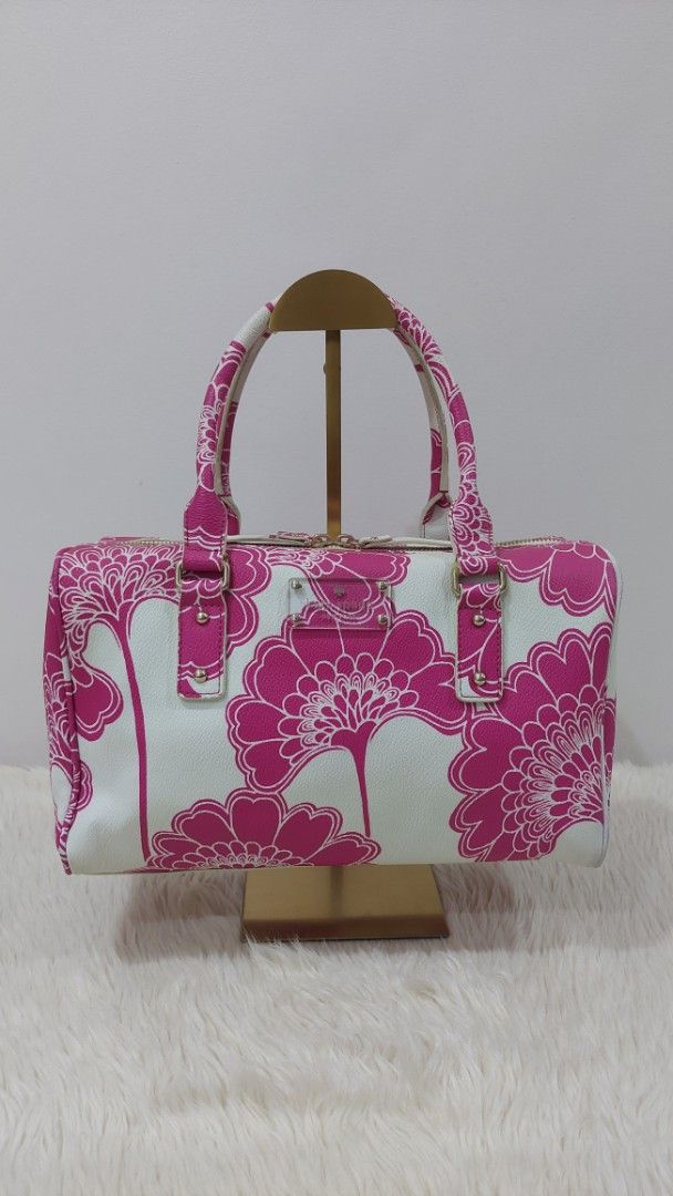 Authentic Kate Spade Cosmetic Handbag (Category: Luxury Bags & Wallets) located in Cainta. Submitted by pouchbucketbags (Listing ID 1395483991, Image 1). Description: - Authentic Kate Spade cosmetic handbag. - Features a beautiful pink and white floral design. - Designed as a vanity bag. - In good condition. - A stylish and functional accessory. - 8"H × 5"W × 12"L - Purchased in Japan.