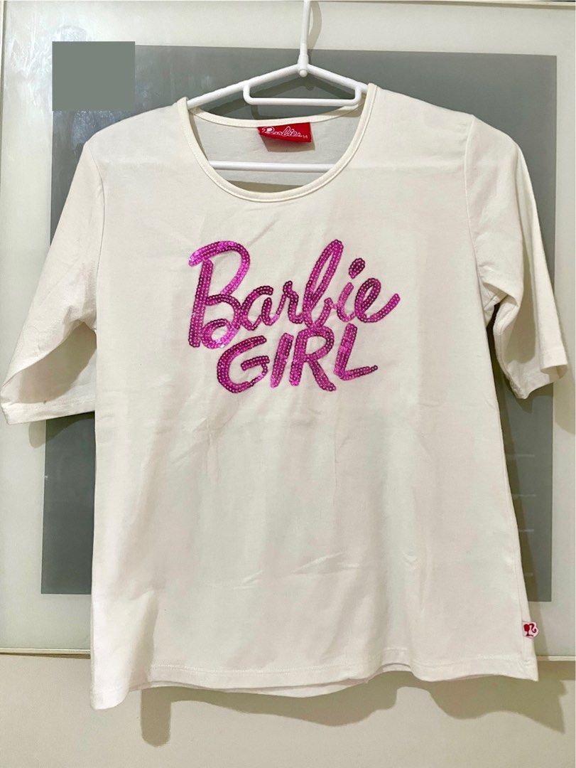 Barbie top for girls (Category: Babies & Kids Fashion) located in Taguig. Submitted by lam_decluttering (Listing ID 1395401046, Image 1). Description: Barbie white top size 14.