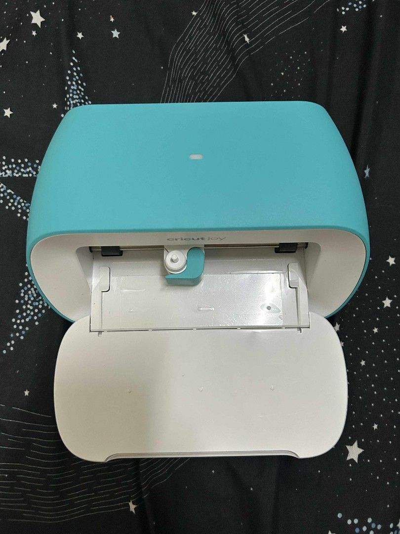 Cricut Joy Cutting Machine (Category: Craft Supplies & Tools) located in Manila. Submitted by re.maven (Listing ID 1395410944, Image 1). Description: - Cricut Joy cutting machine - Color: Teal and white - Includes power adapter - Includes green cutting mat - Perfect for crafting - Ready to use.