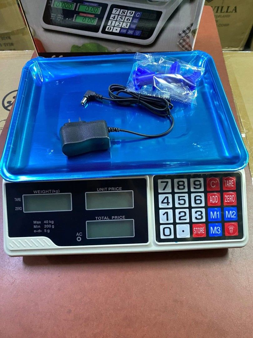 Digital Weighing Scale (Category: Health Monitors & Weighing Scales) located in Manila. Submitted by lyfrancois14 (Listing ID 1395459948, Image 2). Description: - Stella Digital Weighing Scale - Blue tray included - Digital display shows weight, unit price, and total price - Includes AC adapter and power cord - Maximum capacity: 40 kg - Minimum capacity: 5 g - Features tare function.