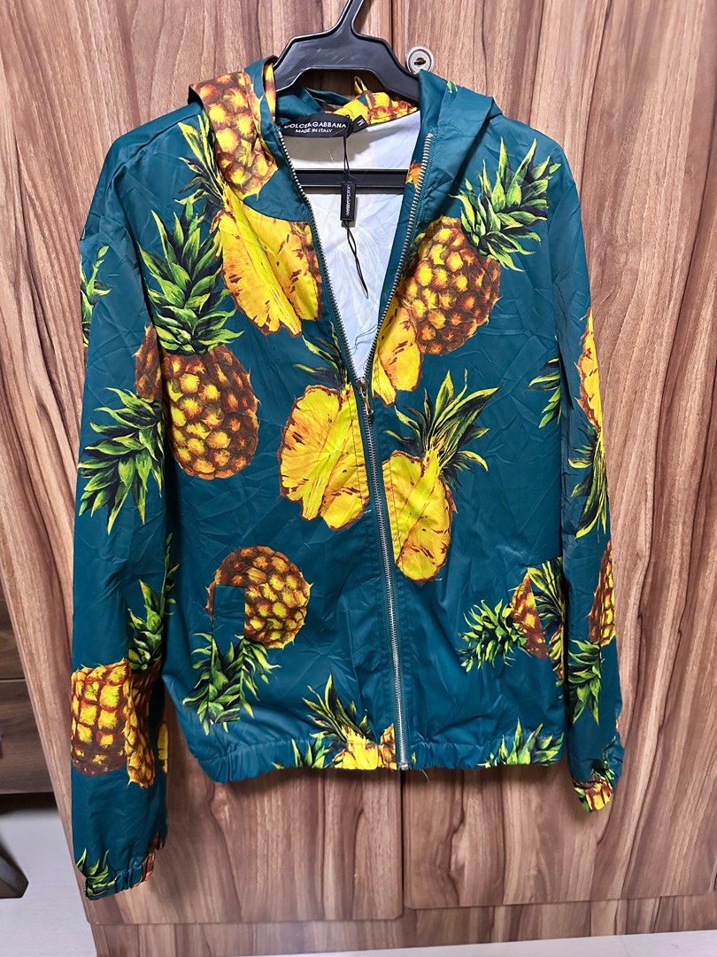 Dolce & Gabbana Pineapple Print Jacket (Category: Coats, Jackets and Outerwear) located in General Santos City (Dadiangas). Submitted by preloved_threads03 (Listing ID 1395506205, Image 2). Description: - Dolce & Gabbana jacket - Vibrant pineapple print - Size: M - Made in Italy - Material: 100% cotton - Features: Hood and zipper closure - Adds a pop of color to your outfit.