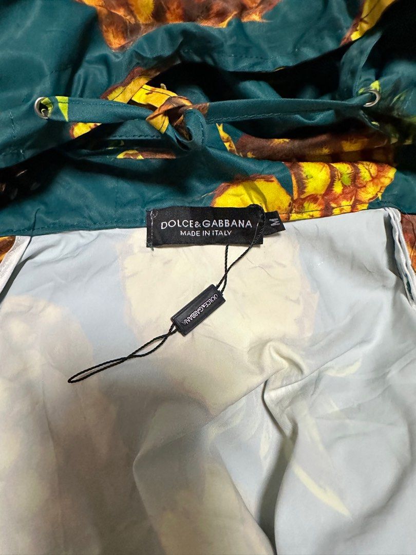 Dolce & Gabbana Pineapple Print Jacket (Category: Coats, Jackets and Outerwear) located in General Santos City (Dadiangas). Submitted by preloved_threads03 (Listing ID 1395506205, Image 1). Description: - Dolce & Gabbana jacket - Vibrant pineapple print - Size: M - Made in Italy - Material: 100% cotton - Features: Hood and zipper closure - Adds a pop of color to your outfit.