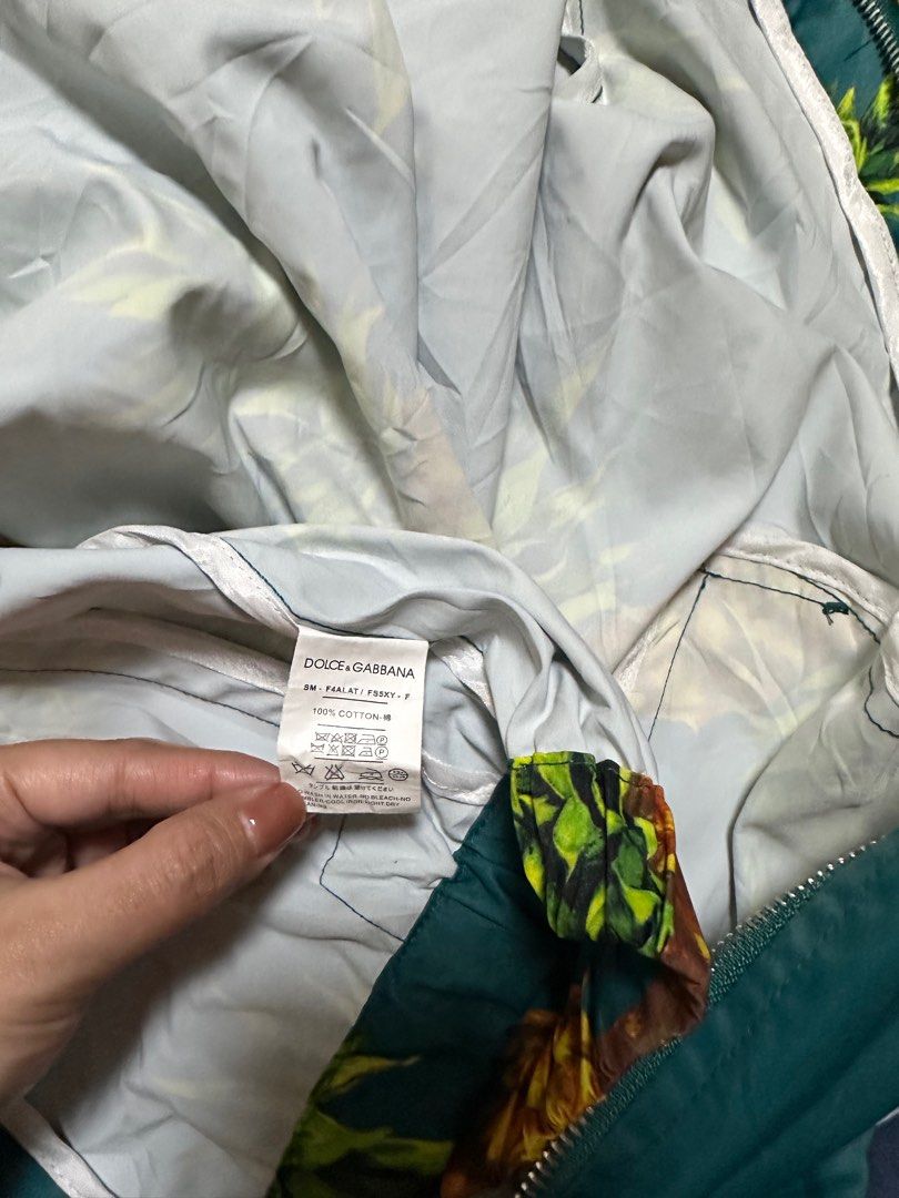 Dolce & Gabbana Pineapple Print Jacket (Category: Coats, Jackets and Outerwear) located in General Santos City (Dadiangas). Submitted by preloved_threads03 (Listing ID 1395506205, Image 3). Description: - Dolce & Gabbana jacket - Vibrant pineapple print - Size: M - Made in Italy - Material: 100% cotton - Features: Hood and zipper closure - Adds a pop of color to your outfit.