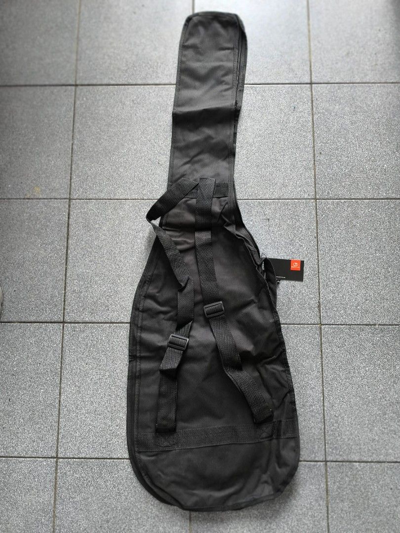 Electric Bass Guitar Bag (Category: Musical Instruments) located in Manila. Submitted by lianlim.mail (Listing ID 1395454503, Image 2). Description: - Black guitar bag/case - for bass / electric or pag manipis na acoustic siguro kasya din. see pic for measurements - Zipper closure - Reflective stripe - Handle and shoulder/backpack style straps - Zippered pocket - Approximately 47" length x 13" width - Brand new, signs of storage only. - 10 pcs av