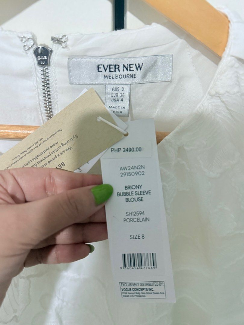 Ever New Briony Bubble Sleeve Blouse Size 8 (Category: Blouses) located in Paranaque City. Submitted by cezhap (Listing ID 1395454335, Image 2). Description: - White Ever New Briony blouse - Size 8 - Round neckline - Short bubble sleeves - Tie-back detail - Zipper closure at the back - Made of cotton - Brand new with original tags.