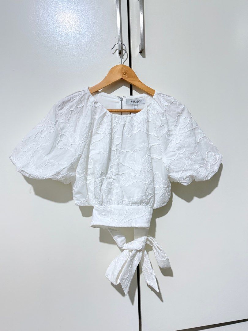 Ever New Briony Bubble Sleeve Blouse Size 8 (Category: Blouses) located in Paranaque City. Submitted by cezhap (Listing ID 1395454335, Image 1). Description: - White Ever New Briony blouse - Size 8 - Round neckline - Short bubble sleeves - Tie-back detail - Zipper closure at the back - Made of cotton - Brand new with original tags.