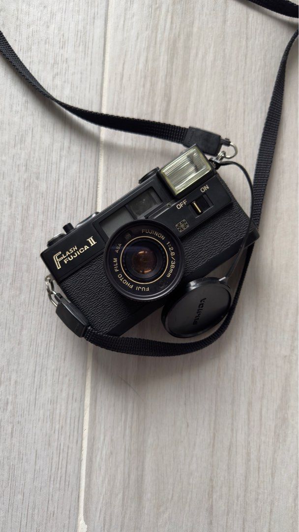 Fujica Flash Fujica II Camera (Category: Cameras) located in Pasig City. Submitted by otherwiseorchid (Listing ID 1395423435, Image 1). Description: Fujica Flash Fujica II camera with Fujinon 38mm lens. Includes lens cap, case, and strap. Built-in flash. Black. Working or not working; Offered as is. Was never used but bought as is to display..