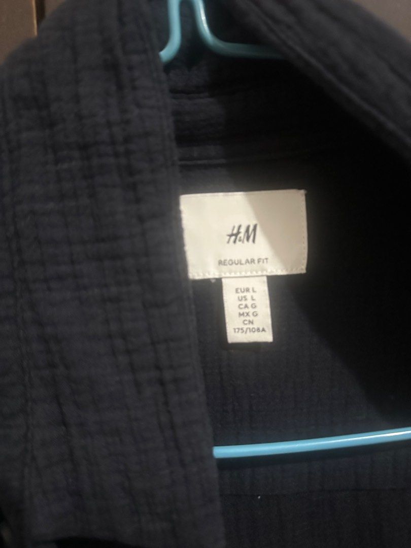 H&M Regular Fit Shirt - Size L (Category: Tshirts & Polo Shirts ) located in Manila. Submitted by drickkkk (Listing ID 1395516089, Image 2). Description: - H&M Regular Fit shirt - Color: Dark blue - Size: L - Design: Collared - Closure: Button-up - Sleeves: Long - Fabric: Textured RFS: Ginamit lang pang boracay - condition: 9.5/10 -Previously purchased for 1999php.