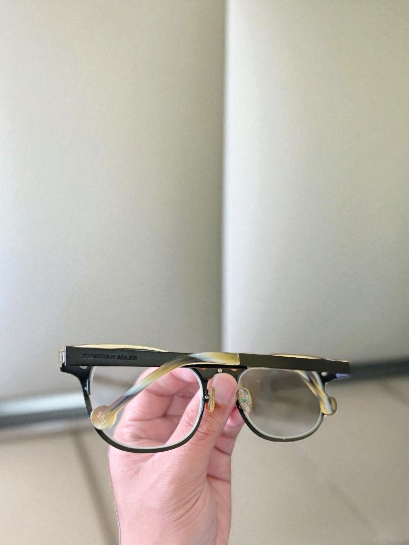 Jonathan Adler Limited edition JA107 Eyeglasses (Category: Sunglasses & Eyewear) located in Tagbilaran City. Submitted by fleetingticks (Listing ID 1395386264, Image 3). Description: - Jonathan Adler eyeglasses - Black frame with gold accents - Unique pattern on arms - Model: JA107 - Clear lenses.