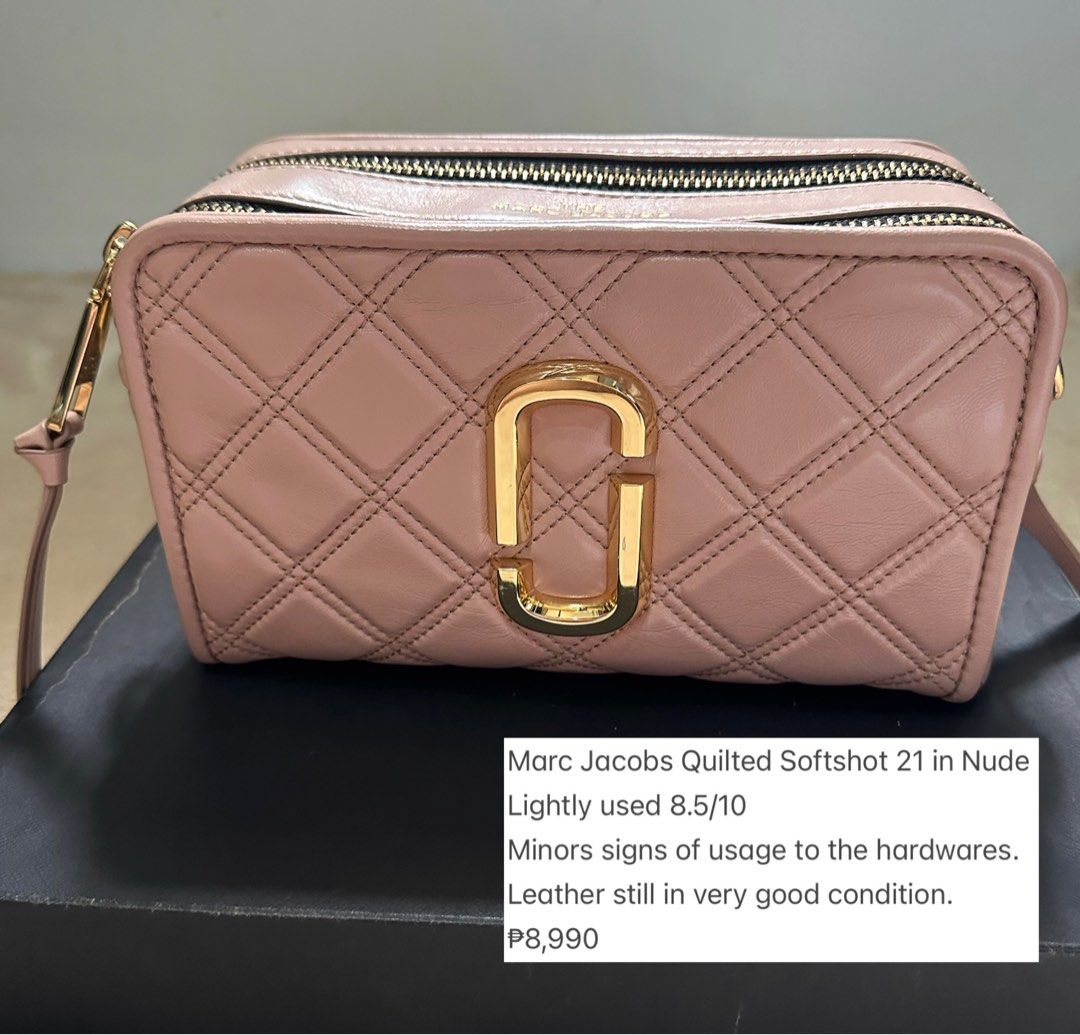 Marc Jacobs Quilted Softshot 21 in Nude (Category: Luxury Bags & Wallets) located in San Fernando. Submitted by jenperezls (Listing ID 1395430508, Image 1). Description: - Marc Jacobs Softshot 21 handbag - Nude color - Minor signs of wear on hardware - Quilted design - Features the Marc Jacobs logo - Stylish and functional accessory.