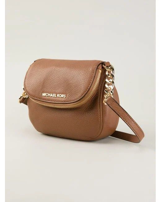 Michael Kors Brown Sling Bag (Category: Luxury Bags & Wallets) located in Manila. Submitted by lovedtwice.ph (Listing ID 1395407021, Image 1). Description: ‼️‼️NO HAGGLING, YOU WILL NOT BE ENTERTAINED, LAST PRICE POSTED ‼️‼️‼️ - Authentic Michael Kors shoulder bag - Brown leather exterior - Elegant gold-tone chain strap - Secure zip closure - Iconic Michael Kors logo on front - Compact and practical size - Stylish curved design - Ideal for everyd
