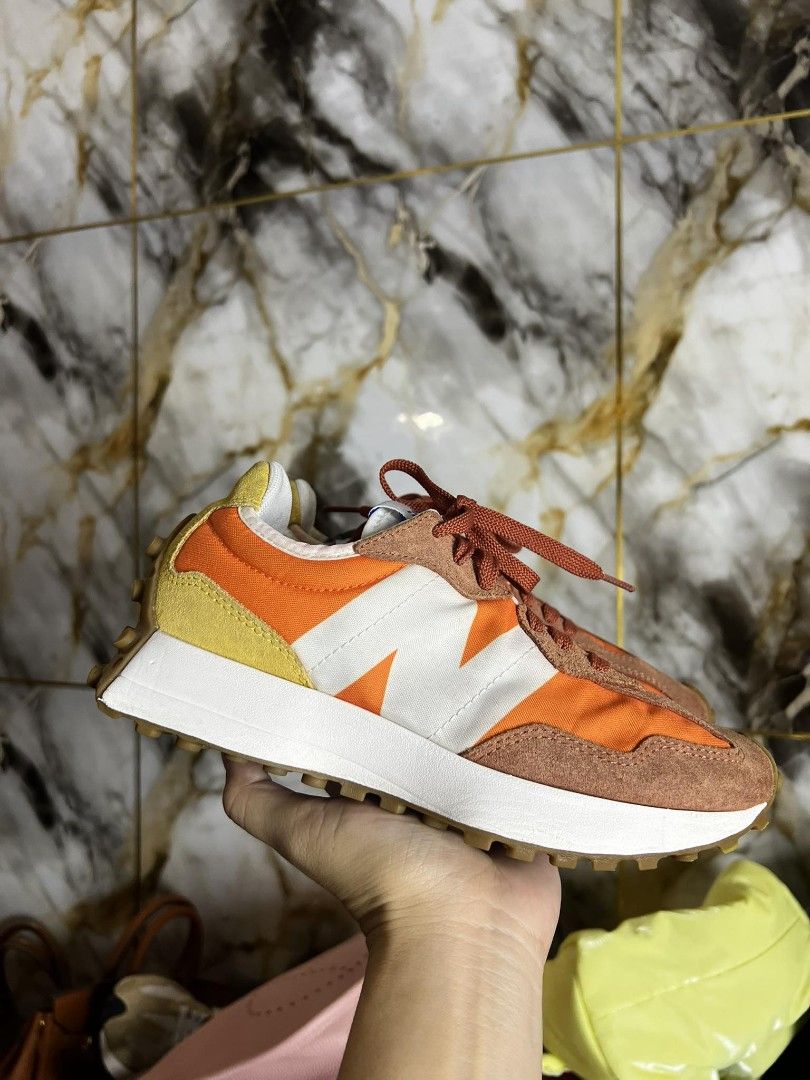New Balance 327 Orange Sneakers (Category: Sneakers) located in Antipolo. Submitted by camry12 (Listing ID 1395391978, Image 2). Description: - New Balance 327 sneakers - Eye-catching orange and yellow color scheme - Retro design - White midsole - Brown outsole - Iconic New Balance logo - Orange laces.