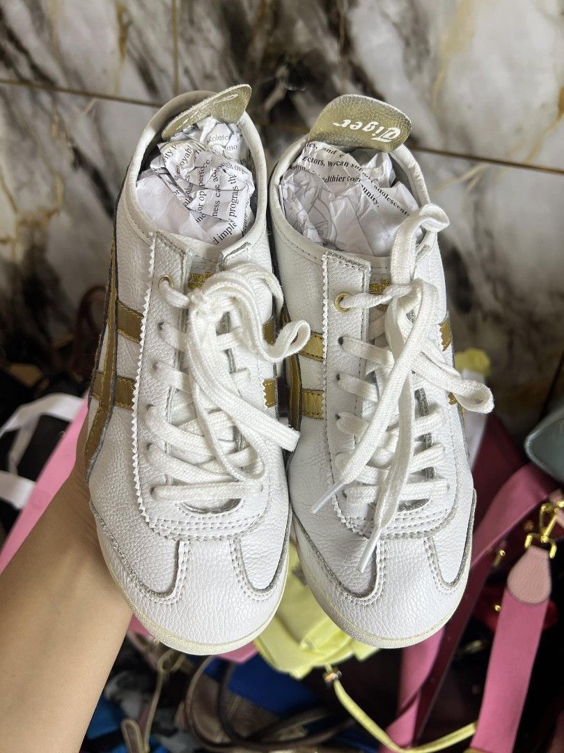 Onitsuka Tiger Mexico 66 White Gold (Category: Sneakers) located in Antipolo. Submitted by camry12 (Listing ID 1395392267, Image 2). Description: - Onitsuka Tiger Mexico 66 - White leather upper - Gold stripes - Rubber sole - Minimal wear - Includes original packaging - Perfect for everyday wear.