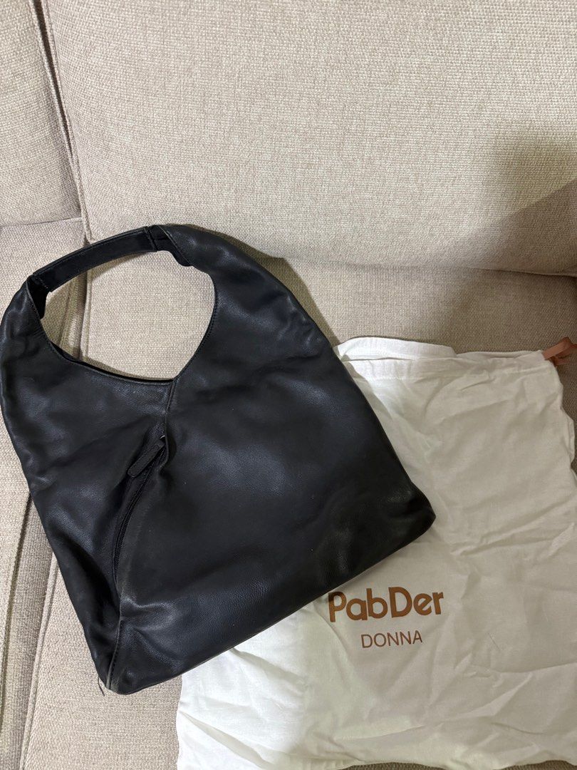 PabDer Donna Black Leather Hobo Bag (Category: Shoulder Bags) located in Quezon City. Submitted by shopdaisyph (Listing ID 1395439541, Image 2). Description: - PabDer Donna black leather hobo bag - Single shoulder strap - Front zippered pocket - Magnetic closure - Includes dust bag - Black interior - Made of soft GENUINE leather Price negotiable. Bought it for around 10k.