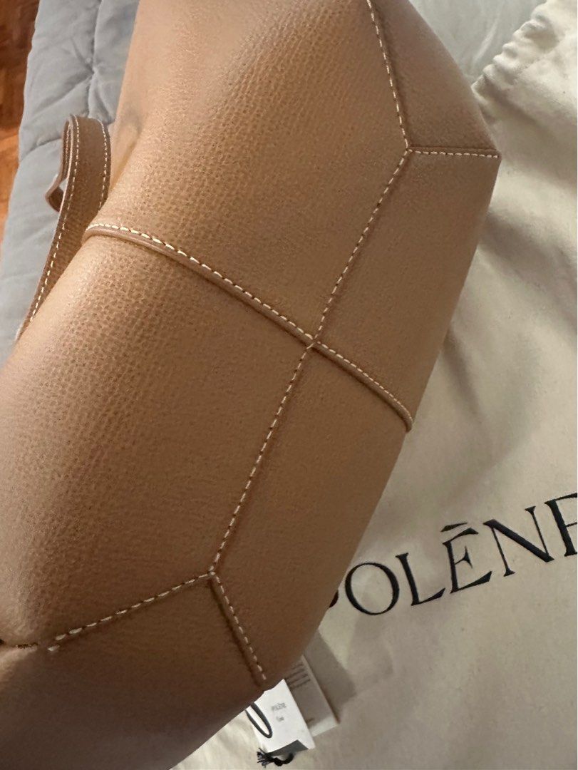 Polene Cyme brandnew (Category: Luxury Bags & Wallets) located in Makati City. Submitted by lms_nat (Listing ID 1395356823, Image 2). Description: Polene Cyme Brand New Regular in Camel With tag and dustbag *no box Can be worn as hand/armbag or shoulder bag. With Magnet side so it Can also open edges to look different (like neverfull style).