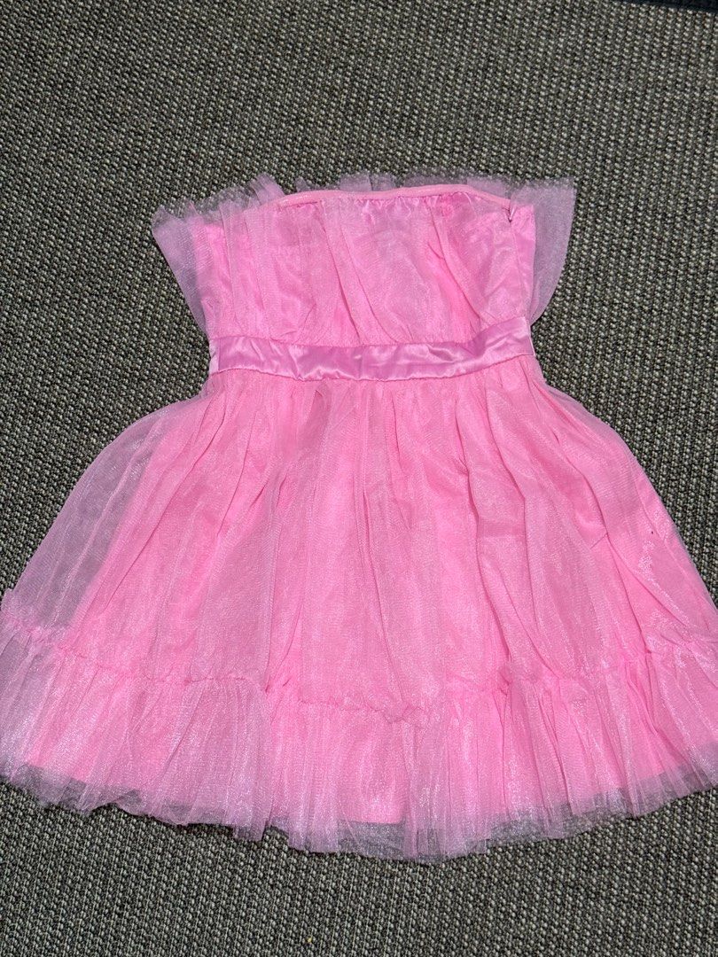 Ruffle Hem Mesh Tube Dress (Category: Dresses) located in Cainta. Submitted by deynamaree (Listing ID 1383655680, Image 3). Description: Ruffle Hem Mesh Tube Dress 💌 A fun, flirty, and feminine dress—perfect for shoots, themed parties, pageants, or special events. Features a ruffled hem, mesh overlay, and soft tube design for that Barbiecore glam look. Color: Cotton Candy Pink Size: XS-S (Altered for better fit) This dress looks stunning in phot