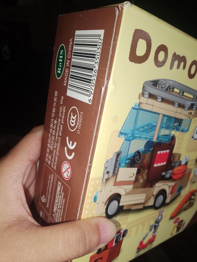 SEMBO Domo-kun Building Block Set (Category: Lego & Building Sets) located in Cainta. Submitted by mydailyell25316 (Listing ID 1395229922, Image 3). Description: - SEMBO building block set featuring Domo-kun in a van. - Includes Domo-kun figure and a yellow bear figure. - Box art shows the van with luggage..