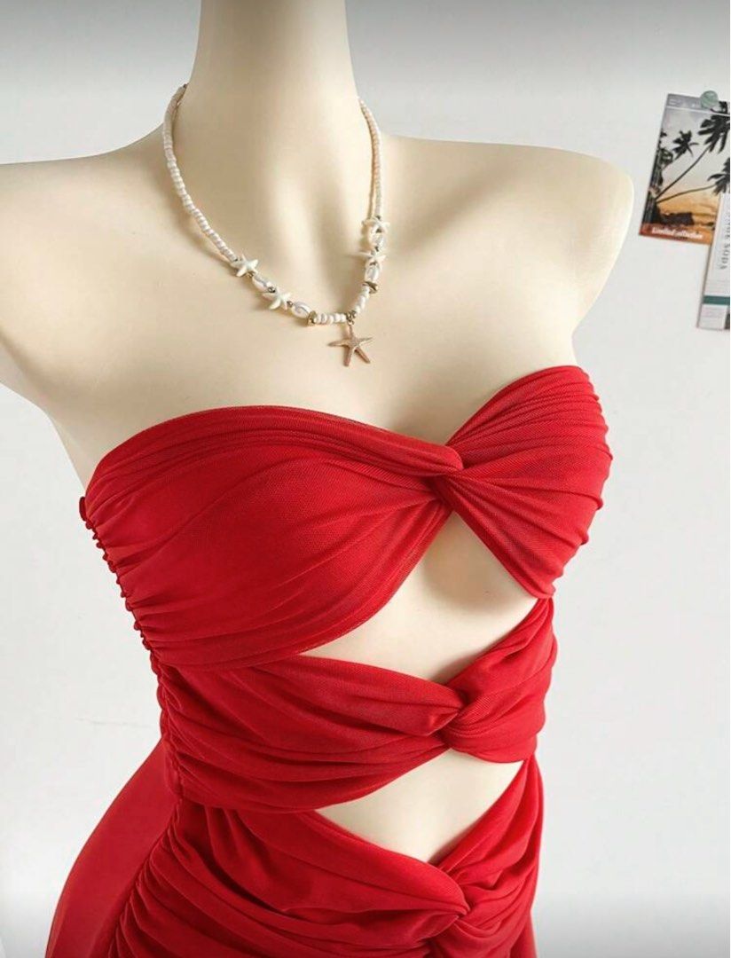 Solei mesh cut out mini dress (Category: Dresses) located in Taguig. Submitted by _vivienne (Listing ID 1395475328, Image 3). Description: - Red mini dress - Strapless design - Unique cut-out detail - Fitted bodice - Flowing skirt - Lightweight, possibly chiffon-like fabric - Perfect for summer outings or special occasions.