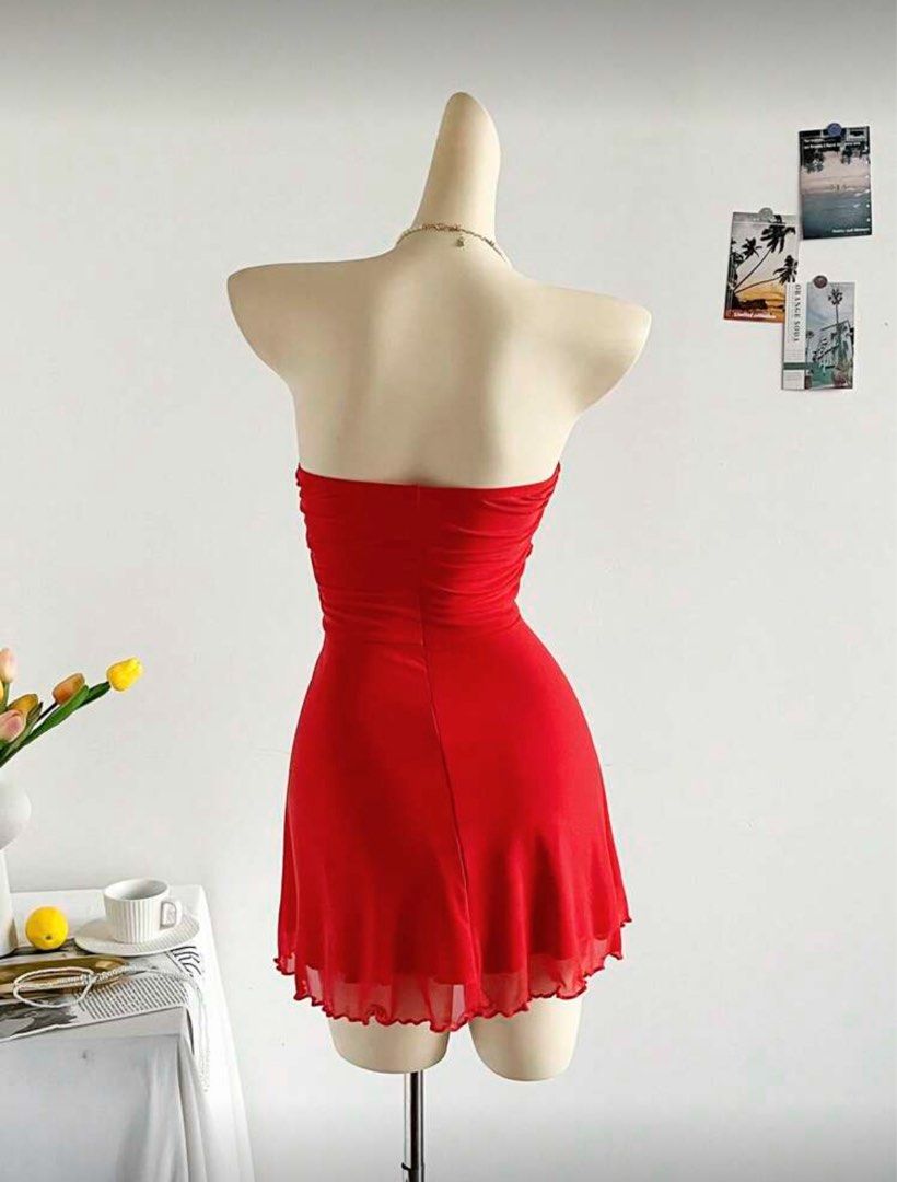 Solei mesh cut out mini dress (Category: Dresses) located in Taguig. Submitted by _vivienne (Listing ID 1395475328, Image 2). Description: - Red mini dress - Strapless design - Unique cut-out detail - Fitted bodice - Flowing skirt - Lightweight, possibly chiffon-like fabric - Perfect for summer outings or special occasions.