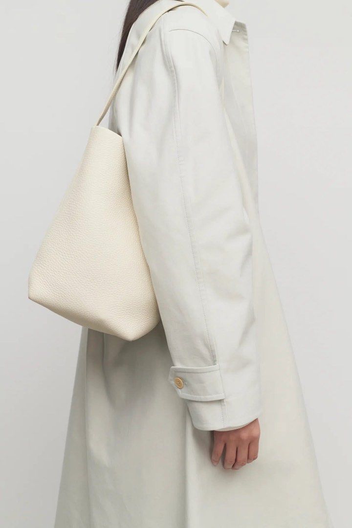 The Row Leather N/S Park Tote Small (Category: Luxury Bags & Wallets) located in Caloocan City. Submitted by eunicepcn (Listing ID 1395481546, Image 1). Description: - The Row Ivory Leather Tote Bag - Small N/S Park Tote style - Single shoulder strap - Spacious interior - Marked "THE ROW" and "MADE IN ITALY" - Ivory color.