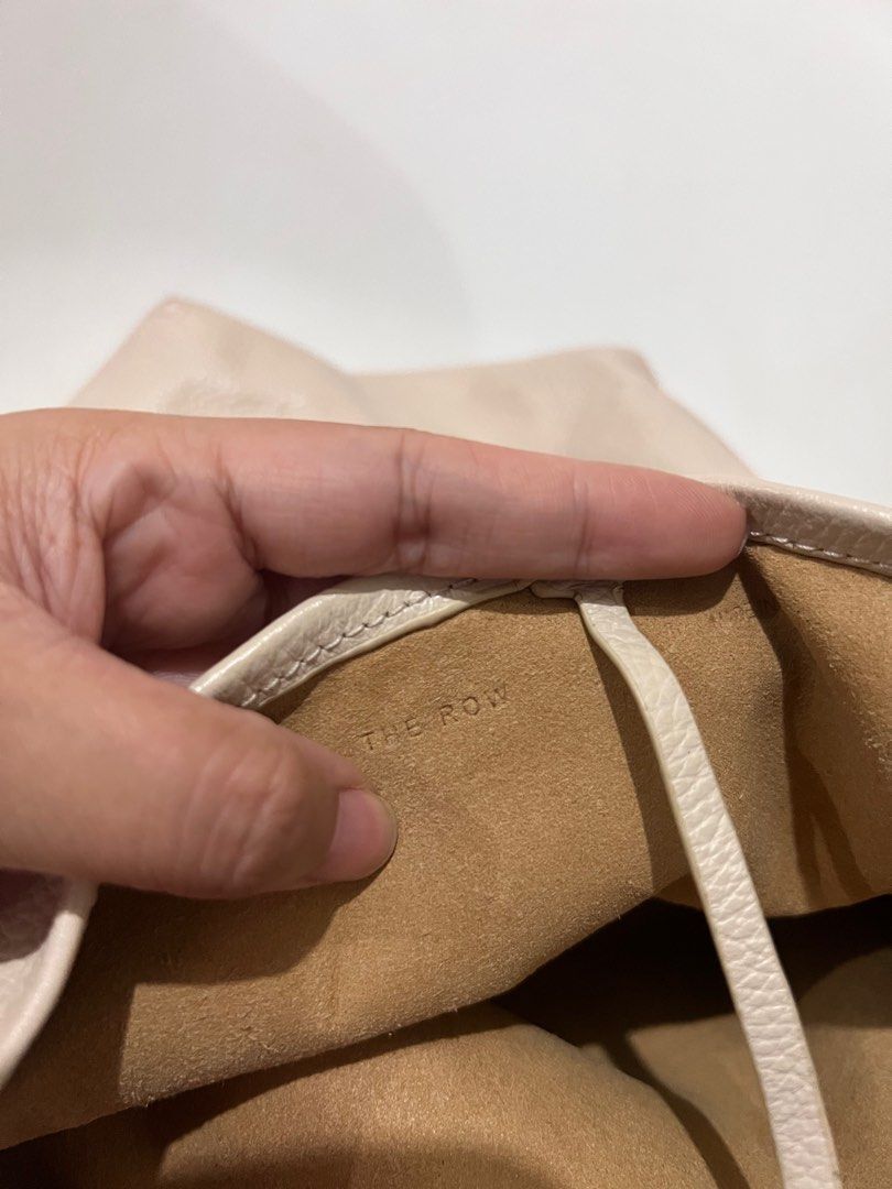 The Row Leather N/S Park Tote Small (Category: Luxury Bags & Wallets) located in Caloocan City. Submitted by eunicepcn (Listing ID 1395481546, Image 3). Description: - The Row Ivory Leather Tote Bag - Small N/S Park Tote style - Single shoulder strap - Spacious interior - Marked "THE ROW" and "MADE IN ITALY" - Ivory color.