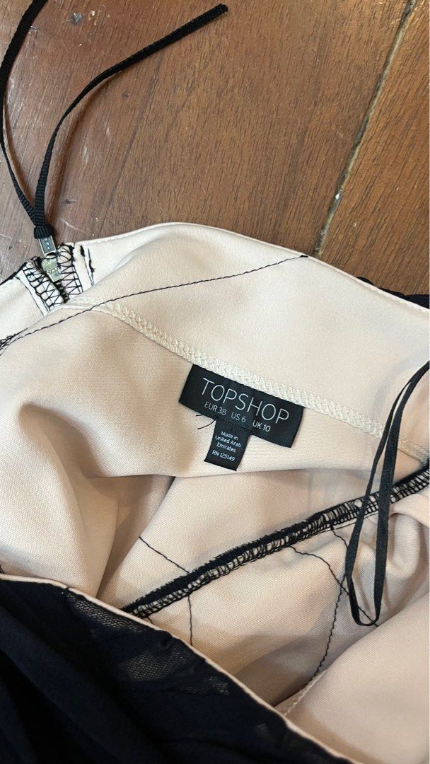 Topshop Black Strapless Dress (Category: Dresses) located in Manila. Submitted by graciesbits (Listing ID 1395472930, Image 3). Description: - Topshop black strapless dress - Ruched design with mesh overlay - Features a back zipper closure - UK size 6 / EUR 38 / US size 10.