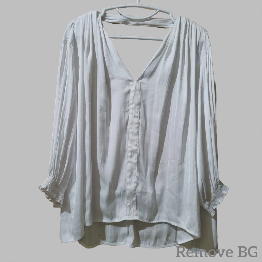 Urban Revivo White Blouse (Category: Blouses) located in Quezon City. Submitted by stylemd (Listing ID 1395459545, Image 1). Description: - Urban Revivo white blouse - V-neck design - Bare upper back - Long sleeves with gathered cuffs - Relaxed fit - Slightly longer back hem - Made of 100% polyester - Unique cut-out detail at the back.