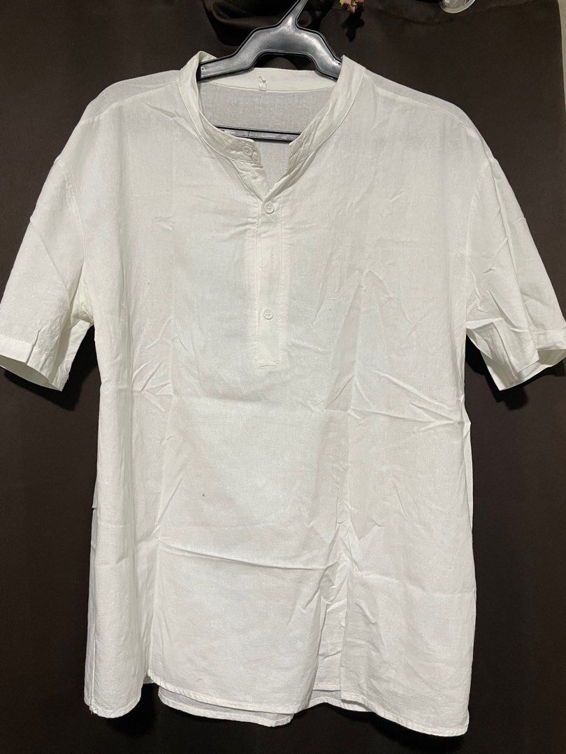 White Short Sleeve Shirt (Category: Tshirts & Polo Shirts ) located in Pasig City. Submitted by archer07 (Listing ID 1395433926, Image 1). Description: - White short sleeve shirt - Mandarin collar - Button-down front - Relaxed fit - Lightweight fabric - Simple design - Perfect for casual wear.