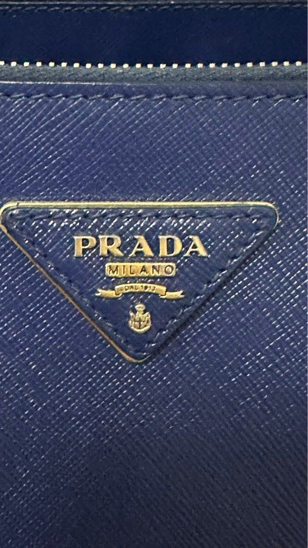 Authentic Prada (Category: Luxury Bags & Wallets) located in Manila. Submitted by chloe_luxuries (Listing ID 1390493838, Image 2). Description: Guaranteed Original Prada Saffiano Lux Double Zip Medium size Comes with longstrap and dustbag Pm for more details .