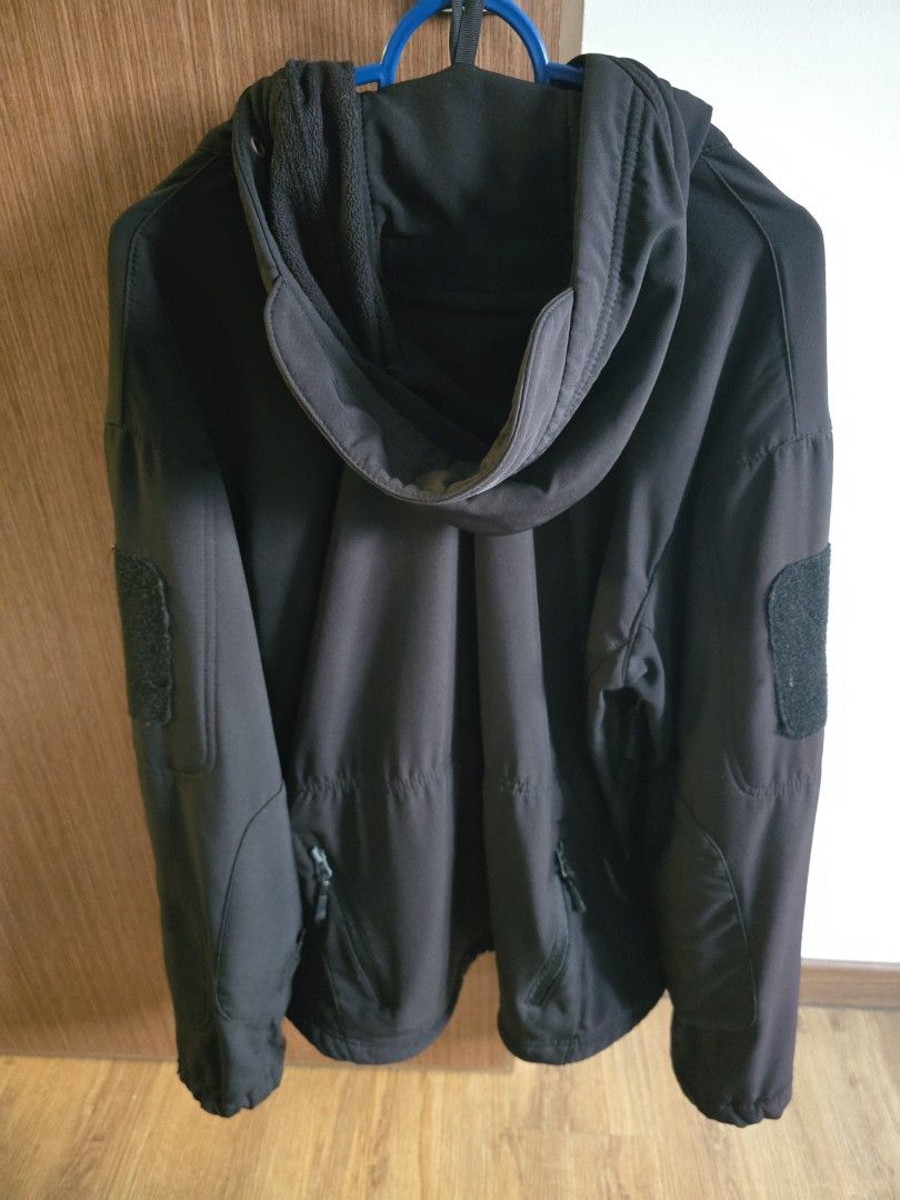 Black Softshell Jacket (Category: Coats, Jackets and Outerwear) located in Singapore. Submitted by monstercookies (Listing ID 1390503247, Image 2). Description: Stylish black softshell jacket. Features multiple zippered pockets and a hood. Perfect for everyday wear or outdoor activities. The jacket is clean and ready to wear..