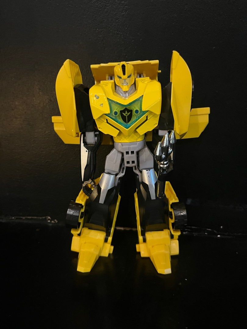 Bumble Bee Transformer (Category: Action & Battle Toys) located in San Jose del Monte. Submitted by learn_andplaywithletty (Listing ID 1390455256, Image 1). Description: This is a Transformers: Robots in Disguise Warrior Class Bumblebee action figure. This figure is part of the Warrior Class line from the Transformers: Robots in Disguise series. It is designed to convert between robot and alternate modes, typically in less than 10 steps. Some ver