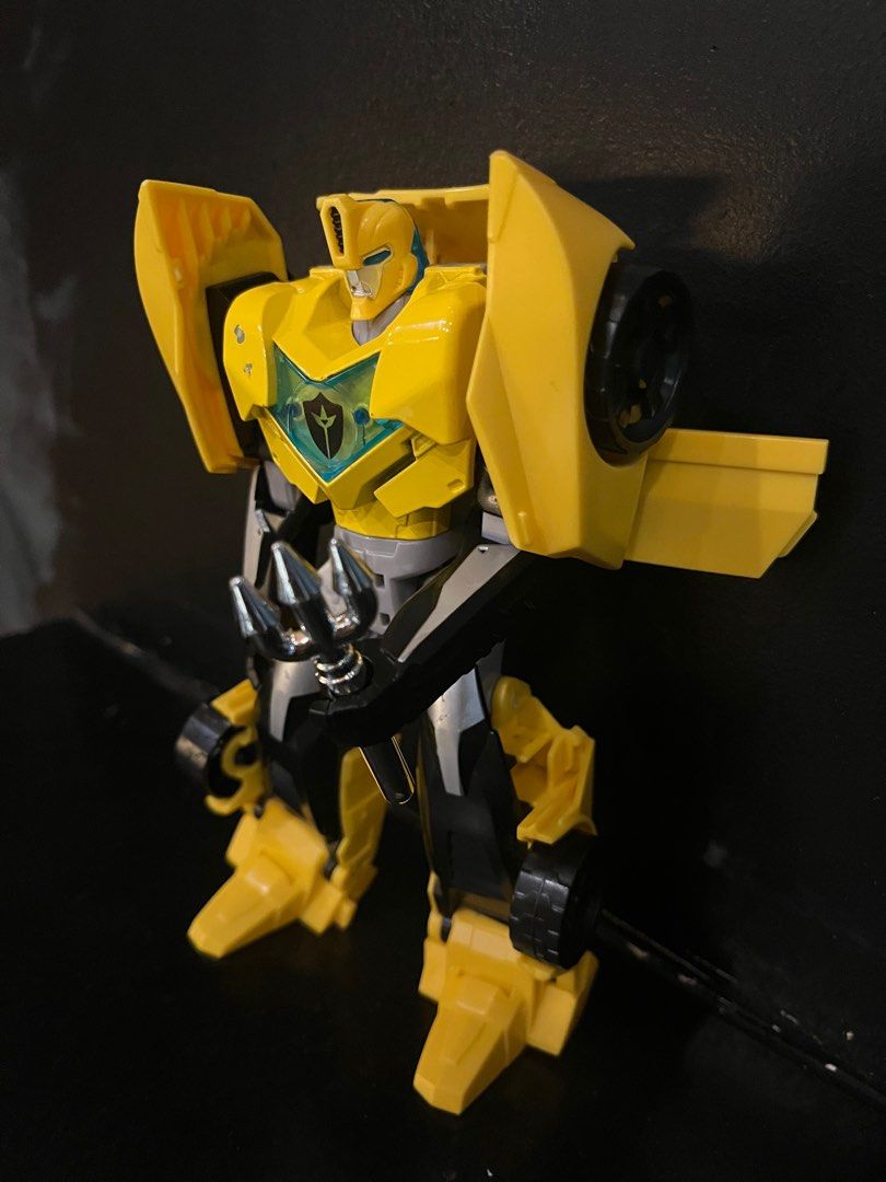 Bumble Bee Transformer (Category: Action & Battle Toys) located in San Jose del Monte. Submitted by learn_andplaywithletty (Listing ID 1390455256, Image 2). Description: This is a Transformers: Robots in Disguise Warrior Class Bumblebee action figure. This figure is part of the Warrior Class line from the Transformers: Robots in Disguise series. It is designed to convert between robot and alternate modes, typically in less than 10 steps. Some ver