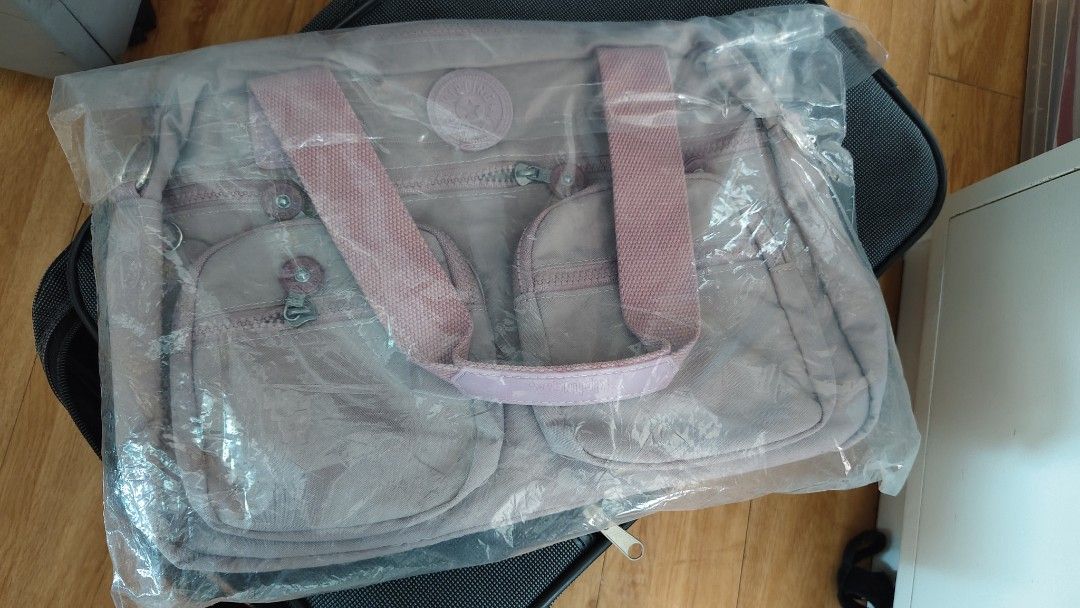 Kipling Shoulder Bag (Category: Shoulder Bags) located in Santa Rosa. Submitted by janelystuff (Listing ID 1390427963, Image 1). Description: This was given to me as a gift, Class A but looks nice and sturdy. Condition: New & unused Color: Lavender Size: Medium.