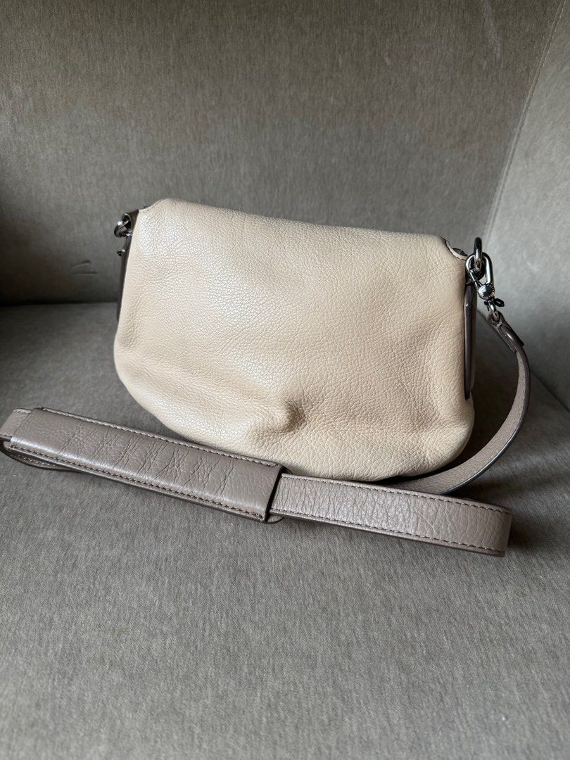 Marc by Marc Jacobs Mini Natasha Bag - Nude (Category: Cross-body Bags) located in Quezon City. Submitted by smt00 (Listing ID 1390440422, Image 2). Description: 100% leather construction with zip pocket flap and long cross body strap. Lightweight and compact. Great travel bag with secret / safety zip compartment. Dimensions: H:18 x W:29 x D:7cm Bought for $185 (P10,600) Selling P5,500 - negotiable .