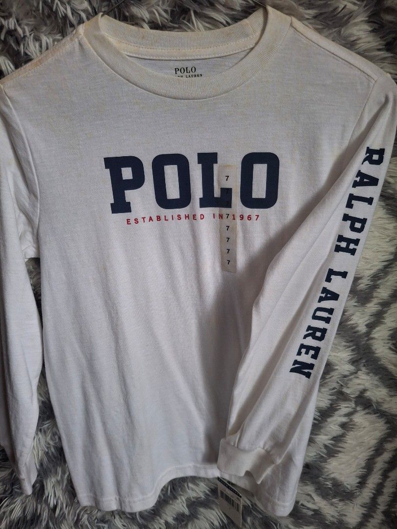 POLO RL (Category: Babies & Kids Fashion) located in Bulacan. Submitted by stacksonracks_ph (Listing ID 1390522958, Image 1). Description: Color: White Length: 20.5 inches Width: 15.5 inches Sleeve length: 19 inches FLAWS: Discoloration sa pagkakatago brand new w/ tag..