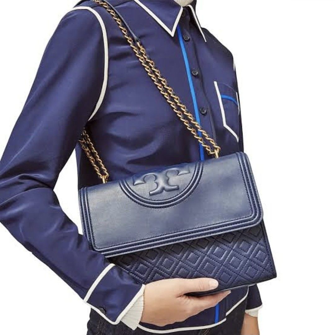TORY BURCH Fleming dark blue with gold hardware two-way (Category: Luxury Bags & Wallets) located in Quezon City. Submitted by rmseller.2017 (Listing ID 1390438921, Image 2). Description: TORY BURCH Fleming dark blue with gold hardware two-way | medium | comes with generic dustbag | P9500 only (open for installment).