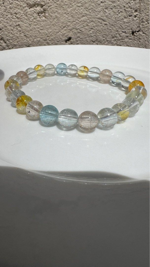 TQ Colorful Topaz (Category: Bracelets) located in Pasay City. Submitted by michell8 (Listing ID 1370270369, Image 2). Description: 7mm+ bead size 16cm wrist size with certificate and box. It helps clear the mind, make better decisions, and improve communication abilities overall. This gemstone is known to calm the mind, heal the body, and soothe the soul, contributing to overall well-being. The potent energy of blue topaz is linked to the throat