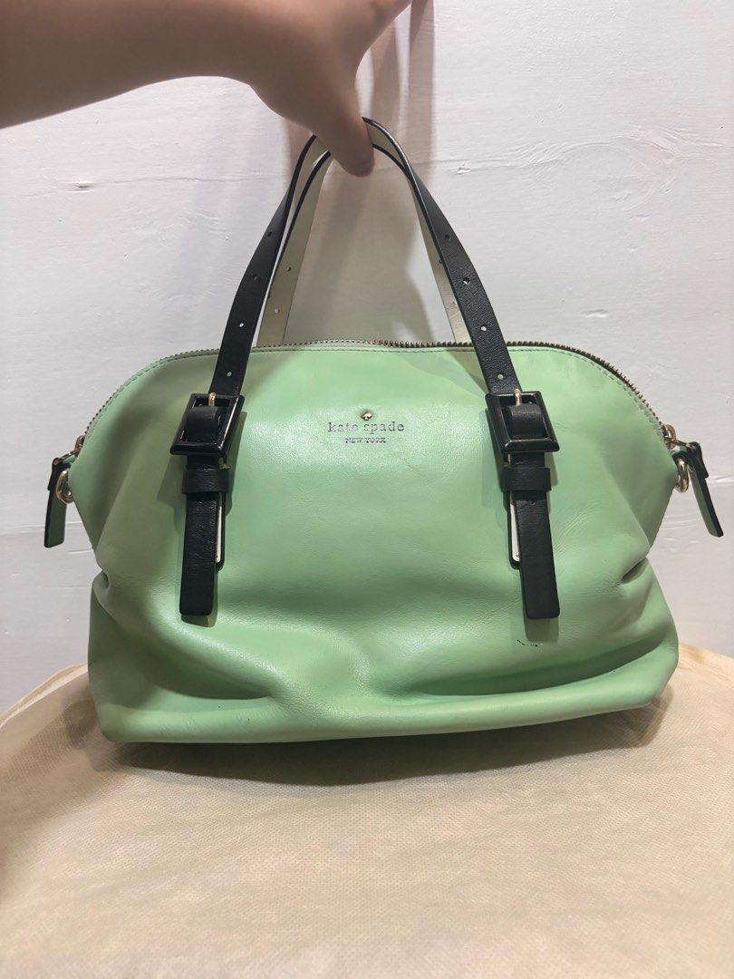 Vintage Kate Spade Dumpling Bag (Category: Luxury Bags & Wallets) located in Manila. Submitted by clearmyclosetmnl (Listing ID 1390589812, Image 1). Description: This authentic, mint colored, two-way Kate Spade Waverly bag was bought ten years ago. The top handle strap of the bag is reversible, and can be worn either in black or white. There is minor cracking with the long strap, but the top handle straps are still intact. .