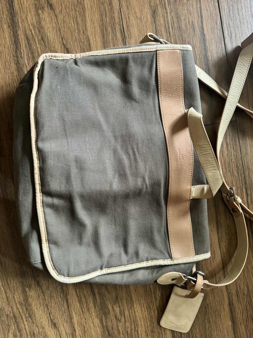 A.P.C. Rue Madame Paris Bag (Category: Luxury Bags & Wallets) located in Mandaluyong City. Submitted by j.alonso (Listing ID 1395582138, Image 2). Description: - A.P.C. bag - Canvas-like material in muted brown - Leather tag included - Tag features brand name and "rue Madame PARIS" embossing - Light tan leather tag Japan APC in almost new unused condition.