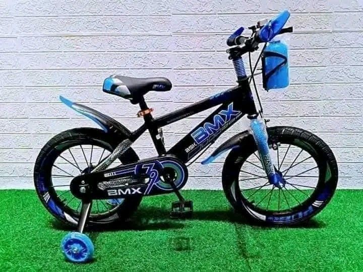 BMX Kids Bike with Training Wheels (Category: Bicycles) located in Manila. Submitted by saguittarian06 (Listing ID 1395643295, Image 1). Description: - Kids' BMX bike - Sturdy frame - Training wheels for stability - Water bottle holder - Fenders included - Black frame with blue or red accents - Ideal for beginner cyclists.