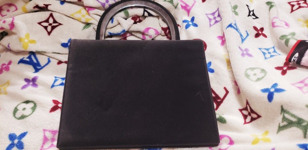 Bruno Magli Black Handbag (Category: Luxury Bags & Wallets) located in Marikina City. Submitted by racoon143 (Listing ID 1395580914, Image 1). Description: - Brand: Bruno Magli - Color: Black - Features: Top handle, flap closure - Interior: Zippered pocket, branded tag - Details: Branded zipper pull - Includes: Certificate of guarantee - Origin: Made in Italy negotiable.