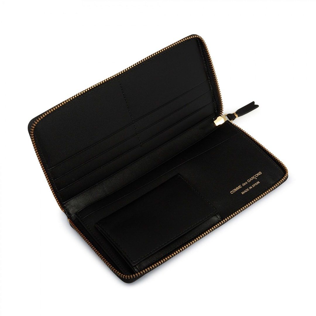 Comme Des Garcons Classic Group Wallet (Category: Luxury Bags & Wallets) located in Dasmarinas. Submitted by bandananowheree (Listing ID 1395594557, Image 2). Description: CDG CLASSIC LINE WALLET SA0110 IN BLACK LEATHER. WRAP AROUND ZIPPER, INTERNAL COIN POUCH AND MULTI CARD SLEEVES, GOLD HARDWARE WITH GOLD COMME DES GARÇONS LOGO ON INSIDE. CLASSIC GROUP WALLET 0110CLASSICB 200MM X 100MM 100% COWHIDE MADE IN SPAIN.