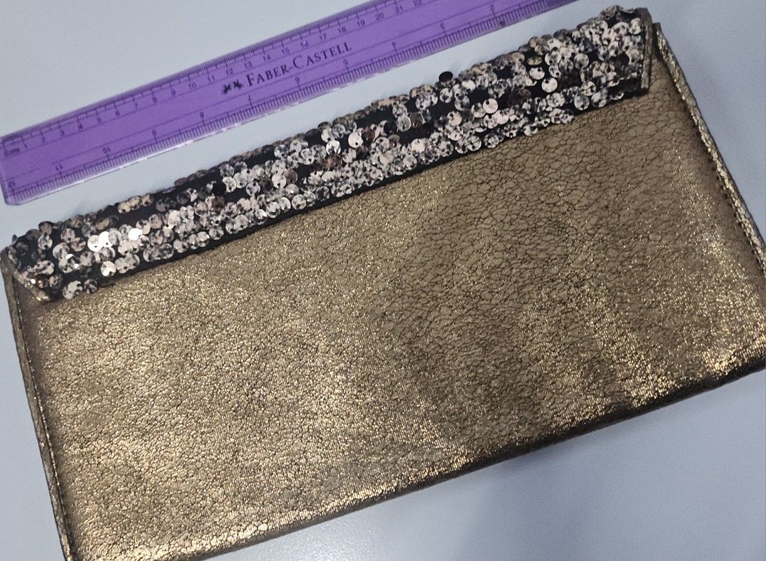 Dorothy Perkins Sequin Clutch Bag (Category: Clutches) located in Manila. Submitted by ivyfcb (Listing ID 1395572125, Image 2). Description: - Dorothy Perkins clutch bag - Gold-tone exterior - Sequin detailing on flap - Zipper closure - Black interior - Perfect for special occasions.