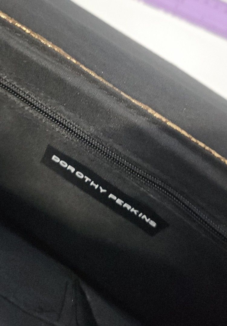 Dorothy Perkins Sequin Clutch Bag (Category: Clutches) located in Manila. Submitted by ivyfcb (Listing ID 1395572125, Image 3). Description: - Dorothy Perkins clutch bag - Gold-tone exterior - Sequin detailing on flap - Zipper closure - Black interior - Perfect for special occasions.