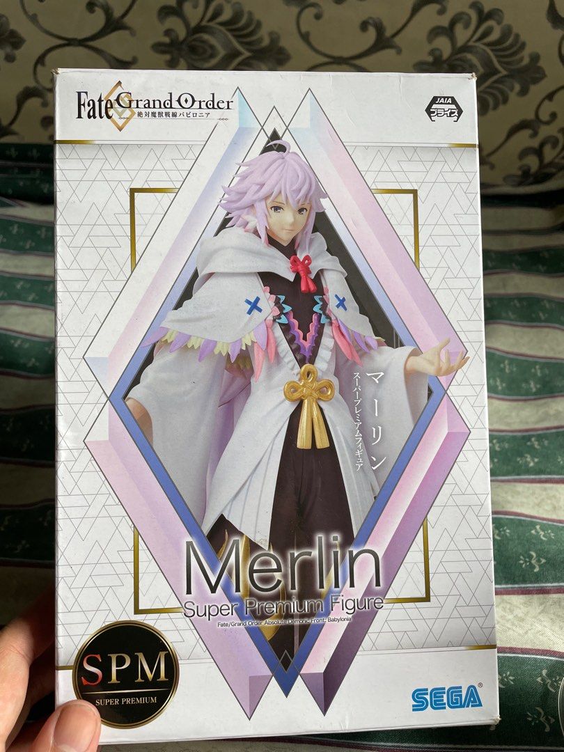 Fate/Grand Order Merlin Super Premium Figure (Category: Figurines & Statues) located in Tiaong. Submitted by pengdwin (Listing ID 1395598811, Image 3). Description: - Merlin Super Premium Figure from Fate/Grand Order - Features Merlin in his iconic outfit - Includes his staff - Made by SEGA - Comes with the original box (Japanese text) - Figure is displayed on a clear stand Rfs: Decluttering .